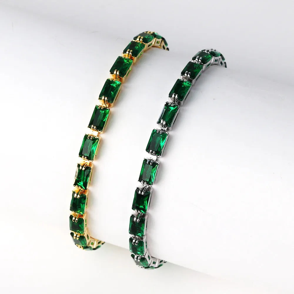 Adjustable electroplated zircon bracelet in gold finish with coloured zircon accents