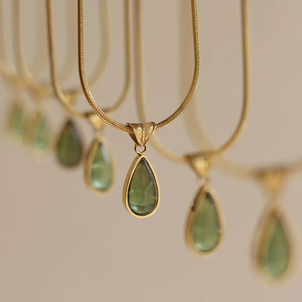 Retro blue and green water drop necklace with gemstone inlay on a titanium steel snake bone chain.