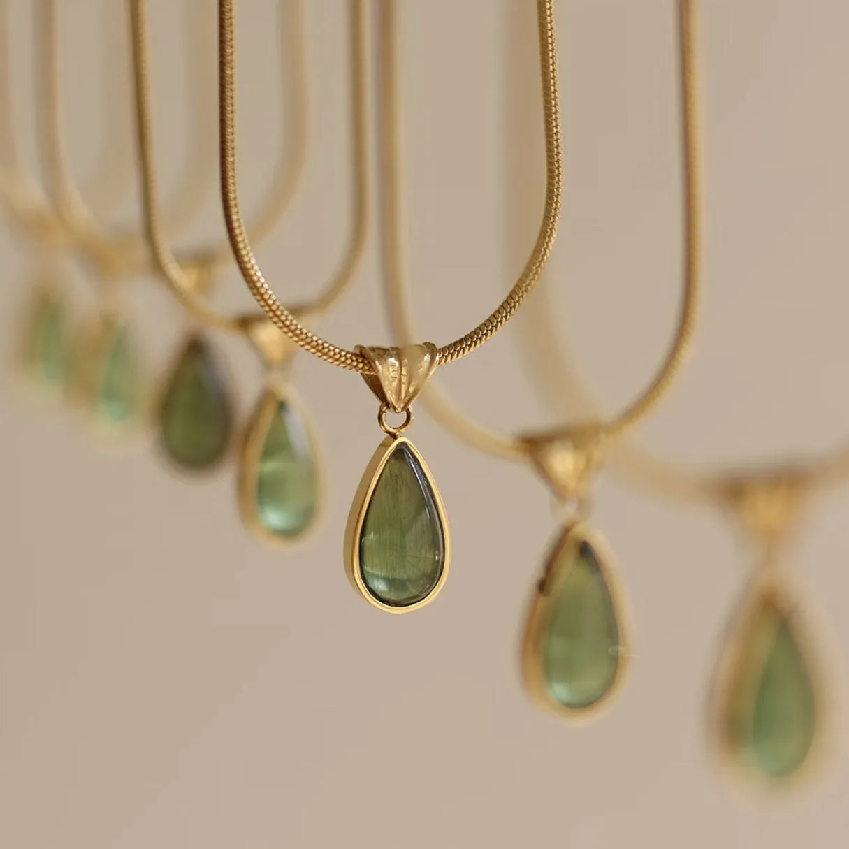 Retro blue and green water drop necklace with gemstone inlay on a titanium steel snake bone chain.