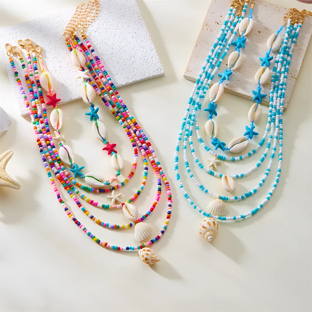 Five multi-layer beaded necklaces with starfish and shell charms in blue and colours