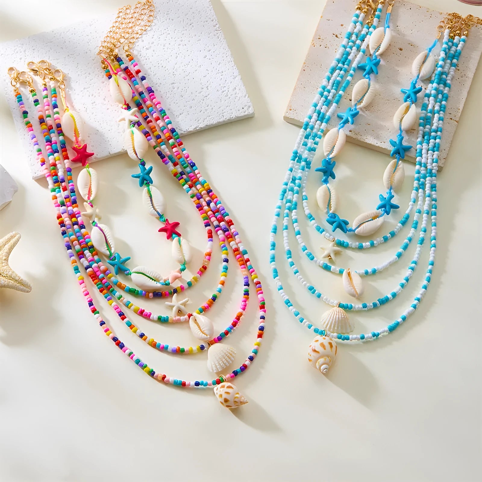 Five multi-layer beaded necklaces with starfish and shell charms in blue and colours