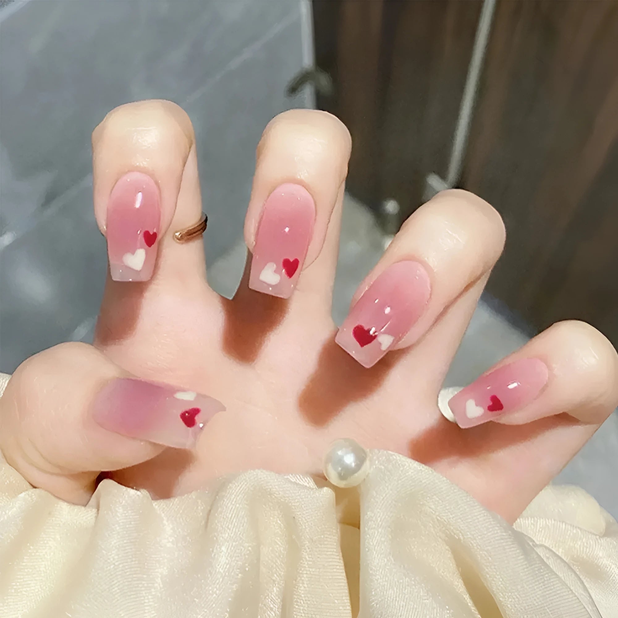 Red and white love gradient nail stickers with starry sky pattern and glue tube