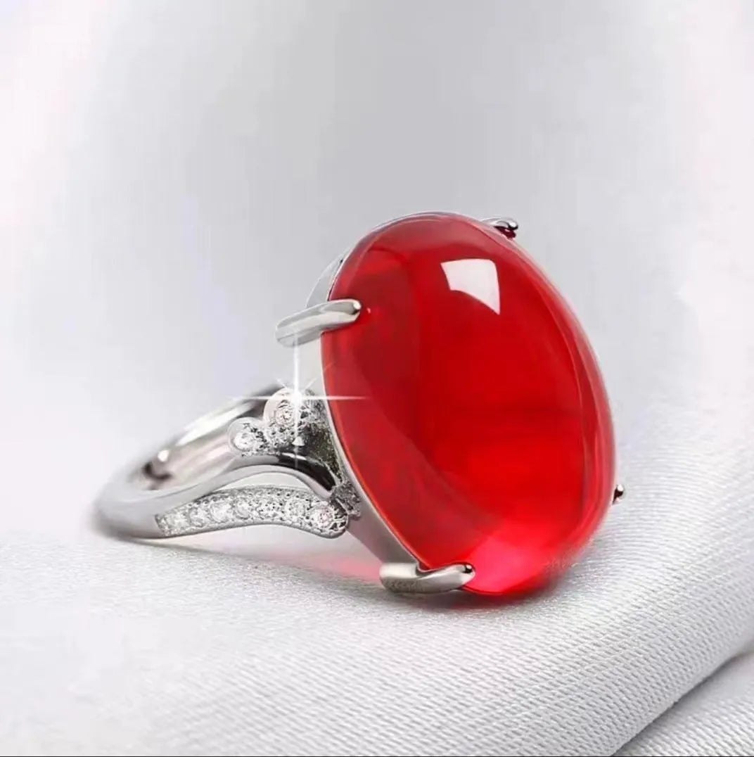 Adjustable geometric ethnic-style alloy ring with a natural sapphire, shown in multiple colour options.