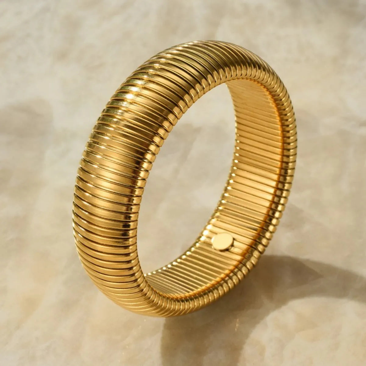 Women's titanium steel bracelet with vertical stripe pattern in gold or silver finish