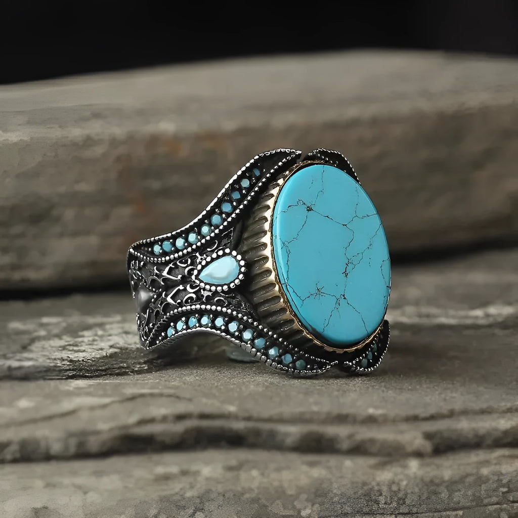 Men's antique silver alloy ring with round turquoise stone on finger