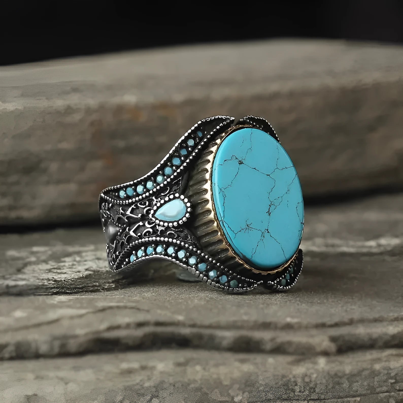 Men's antique silver alloy ring with round turquoise stone on finger