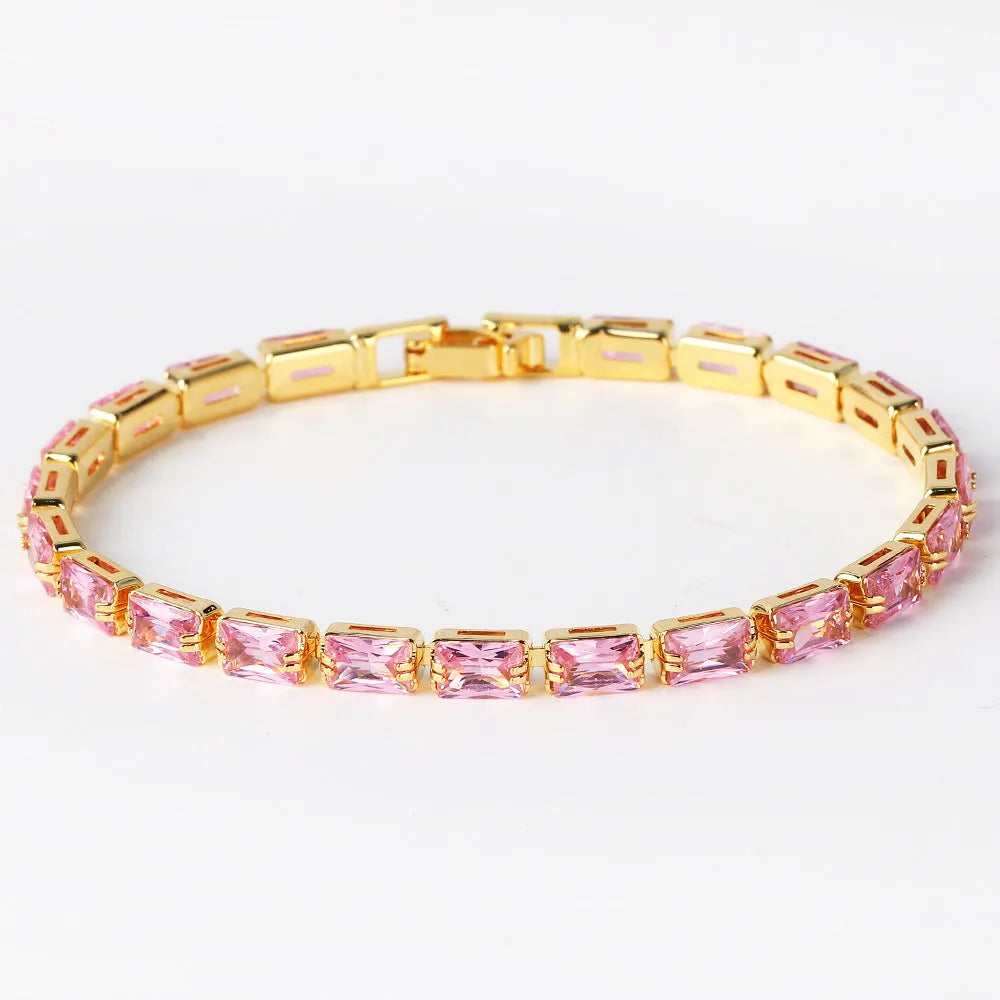 Adjustable electroplated zircon bracelet in gold finish with coloured zircon accents