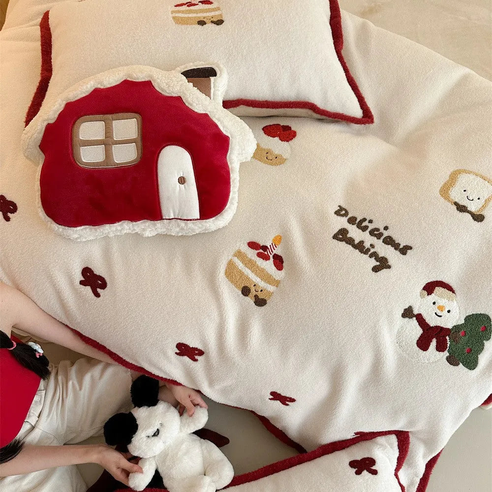 Winter Christmas cartoon bedding four-piece set with snowman and heart pattern on duvet cover and pillowcases.