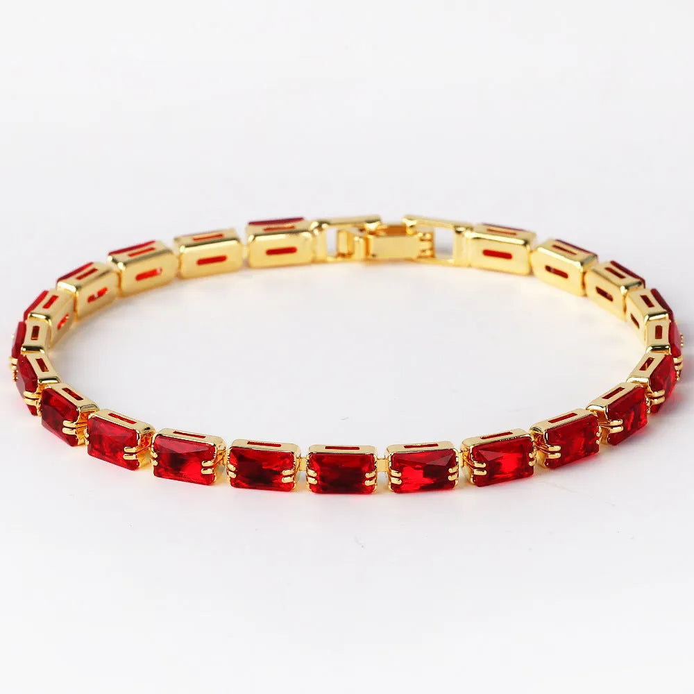 Adjustable electroplated zircon bracelet in gold finish with coloured zircon accents