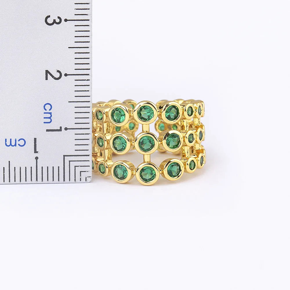 Copper ring with 18K gold plating and green zircon accents in wide band three-layer design