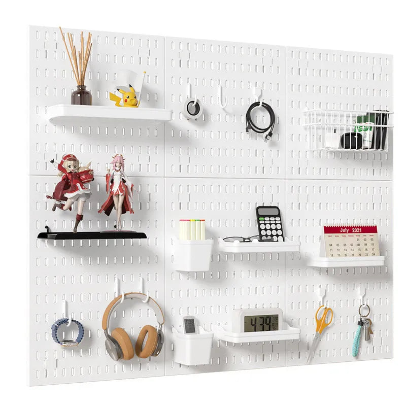 White plastic punch-free wire-wrap board organising cables on wall with modular panel design