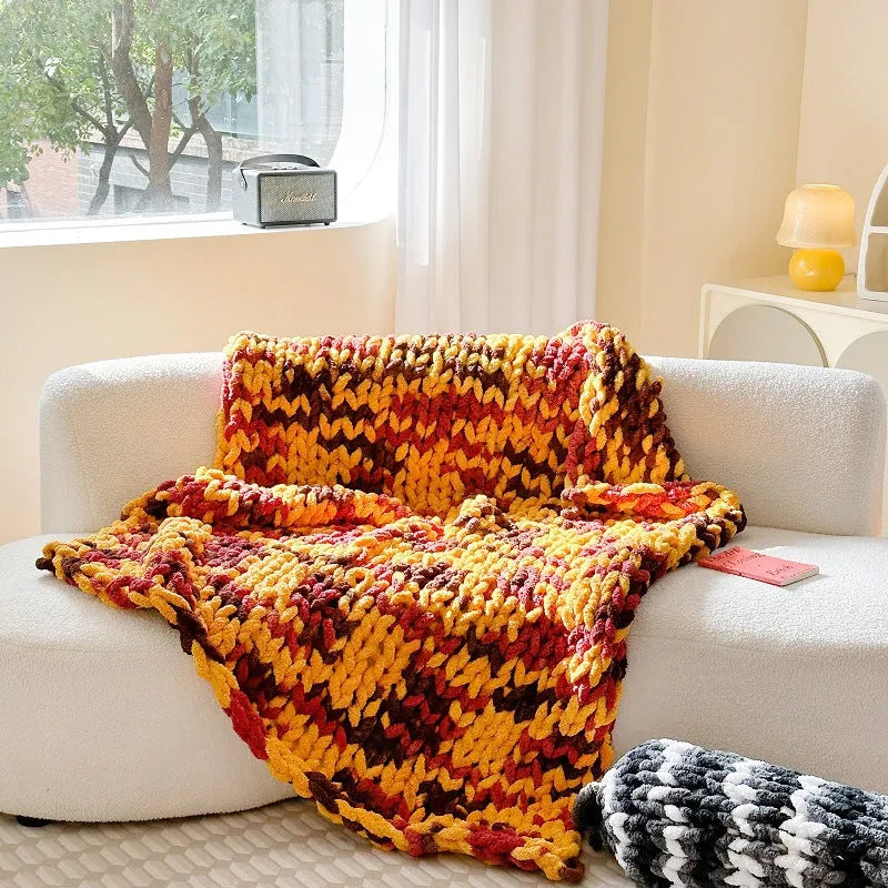 Thick striped chenille blanket in a choice of four colours, shown laid flat displaying its 130x170cm size.