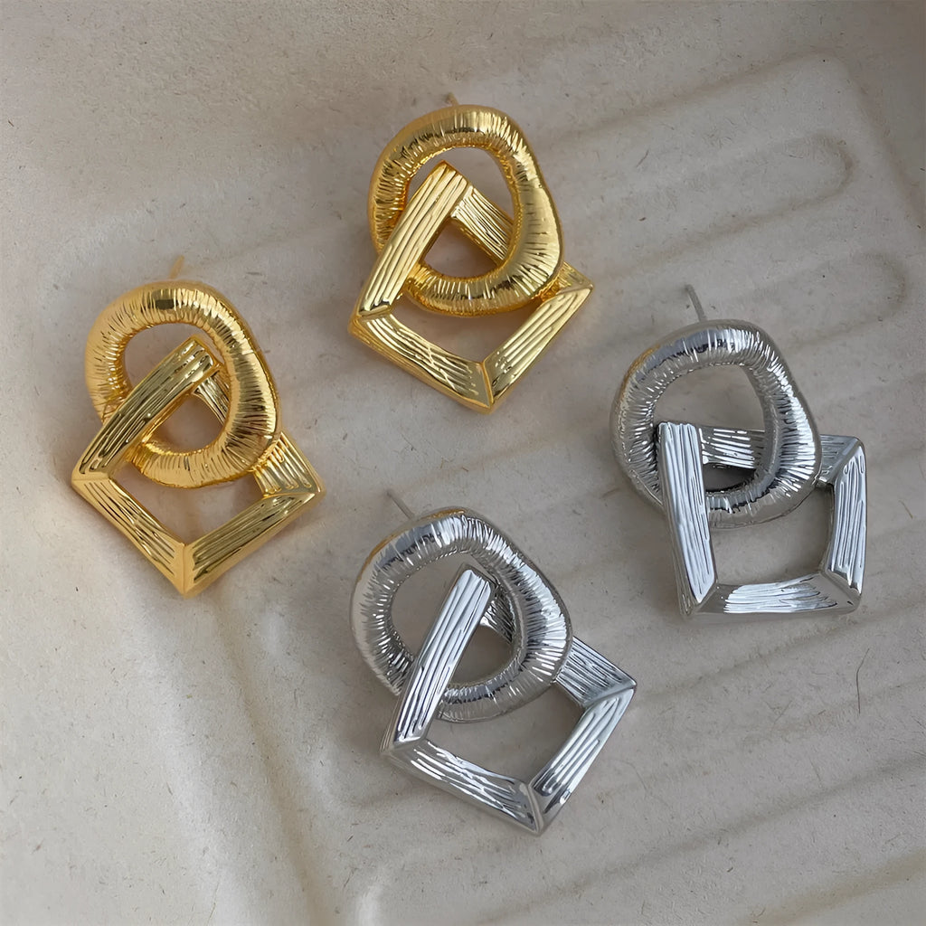 Geometric circle pendant earrings with gold electroplated finish showing 3.4 cm height measurement