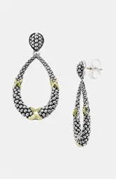Retro antique silver earrings with animal zodiac motif on silver background