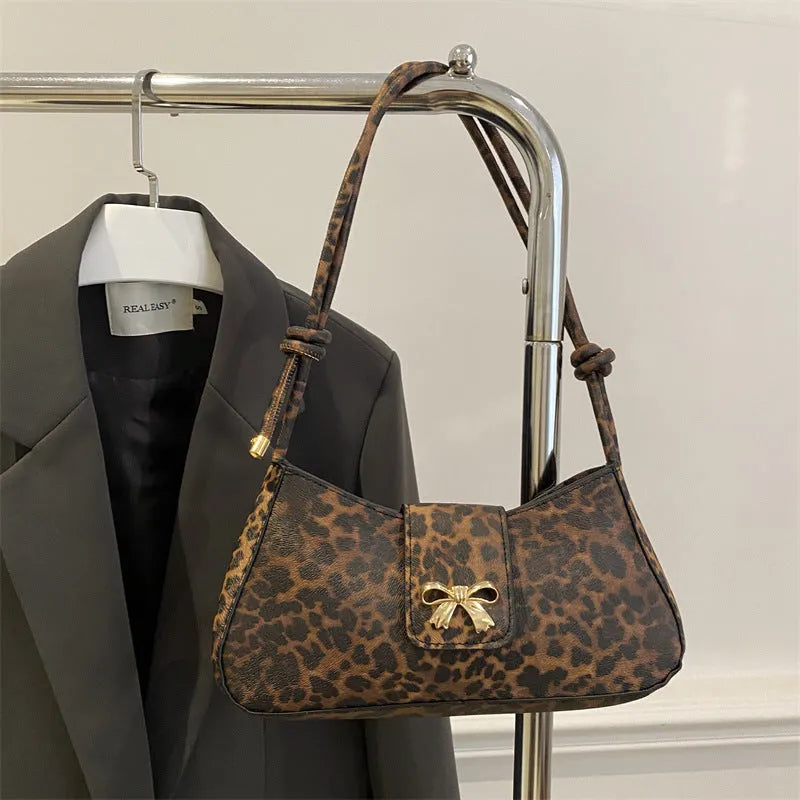 Women's casual handbag in black PU leather with sandwich pocket design measuring 27x13.5x6cm