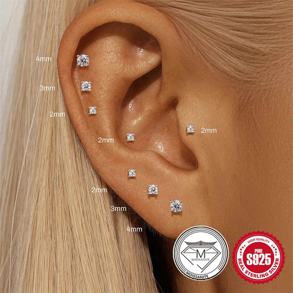 A pair of S925 sterling silver geometric petal stud earrings with a platinum finish, shown in a clip-on style.