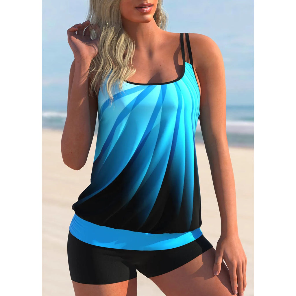 Plus size women's swimsuit set with butterfly print strappy top and matching blue beach shorts.