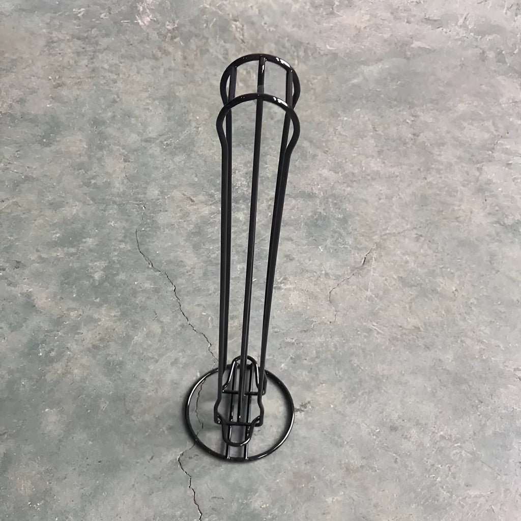 Wrought iron coffee capsule storage rack holding multiple pods with spray black finish
