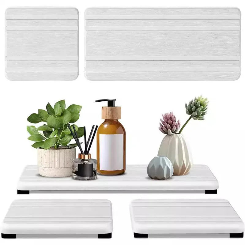 Set of three square diatomite bathroom countertop drying mats in solid grey colour.