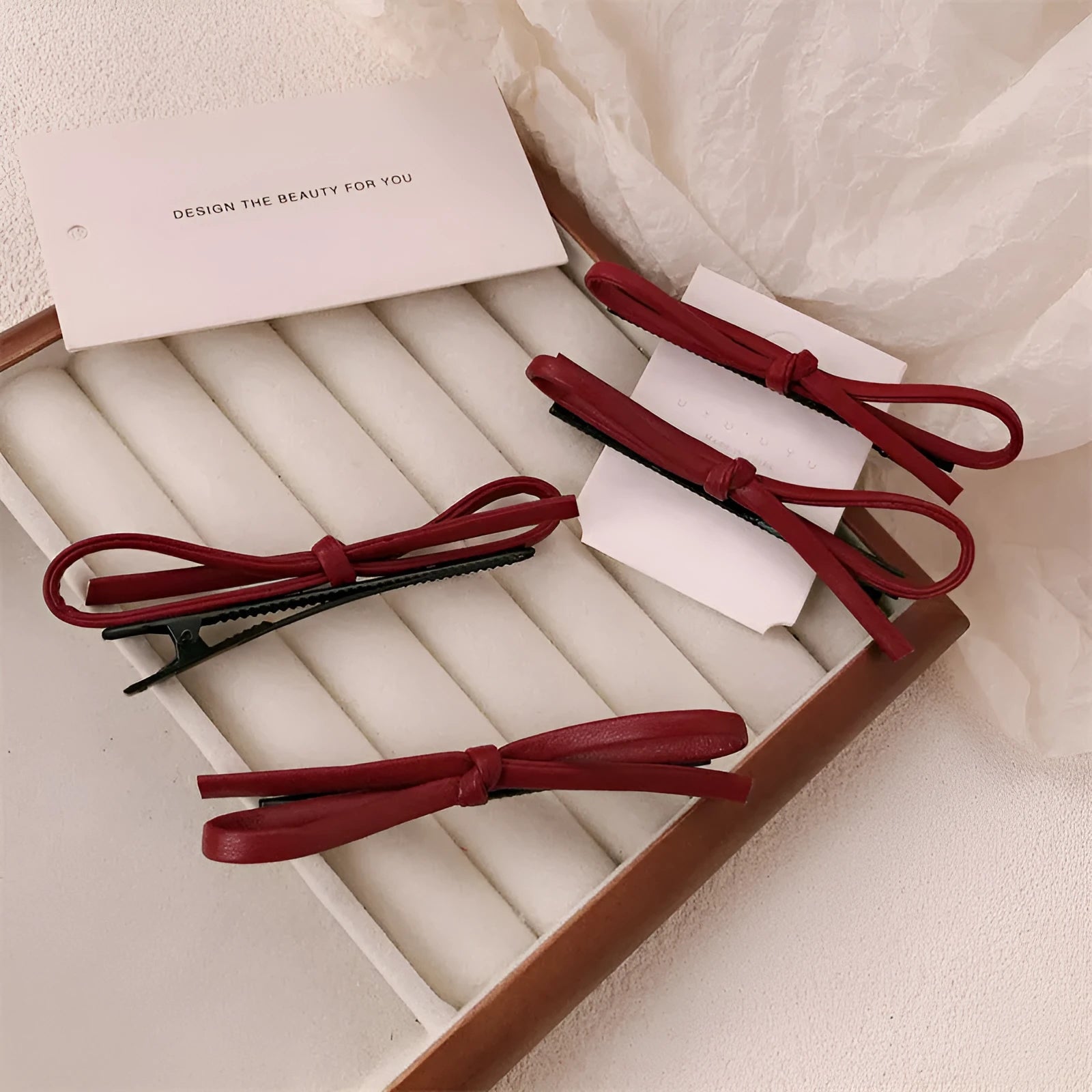 Wine red leather bow barrettes hair clips showing bow design and leather material