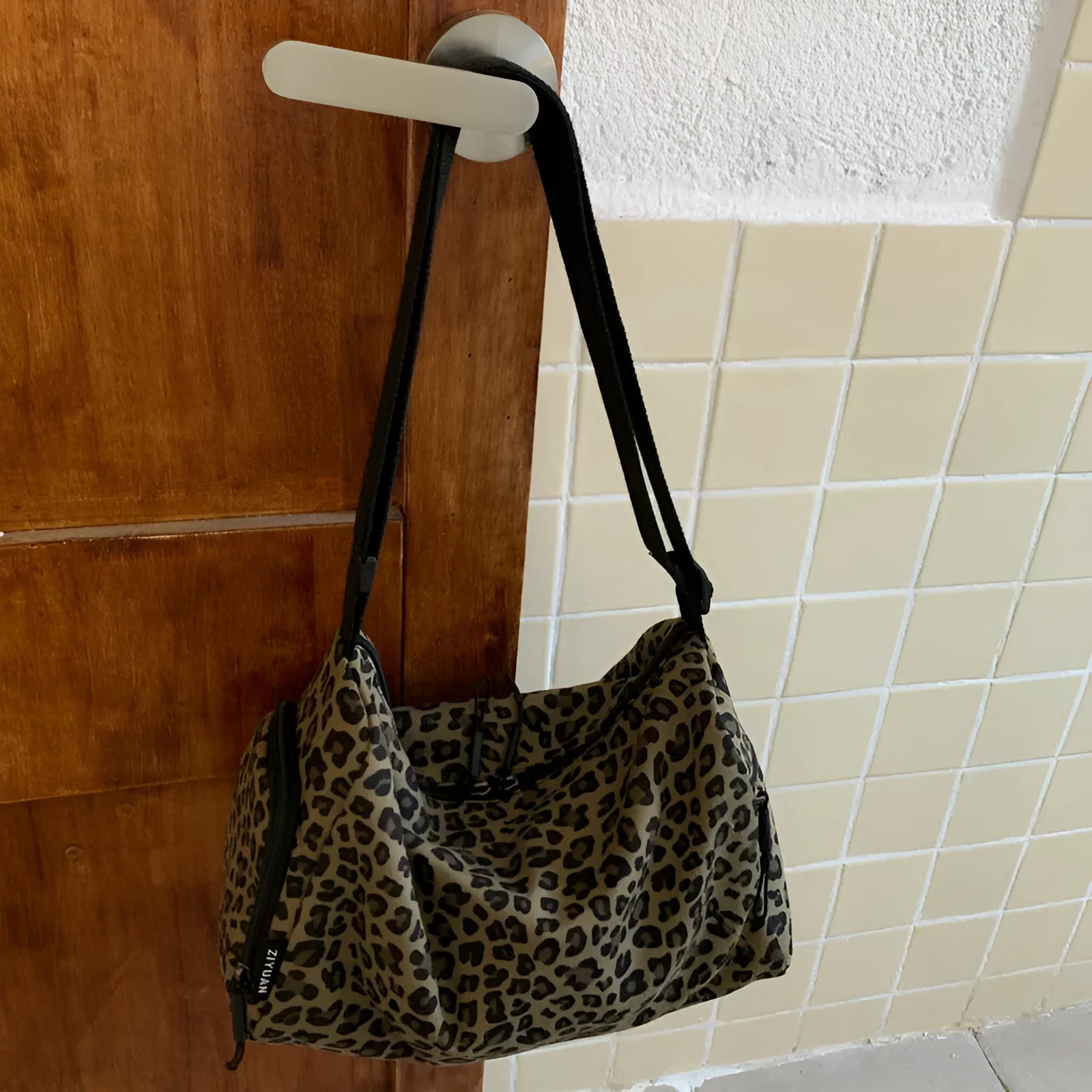Leopard print sports messenger crossbody bag with large capacity and cloth construction