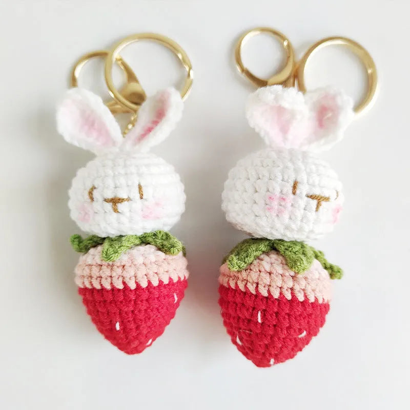 White hand-woven wire pendant with cartoon rabbit strawberry design and attached metal key