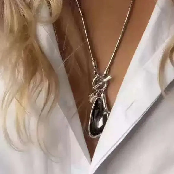 Long geometric sweater chain necklace with alloy water drop pendant on snake bones chain.