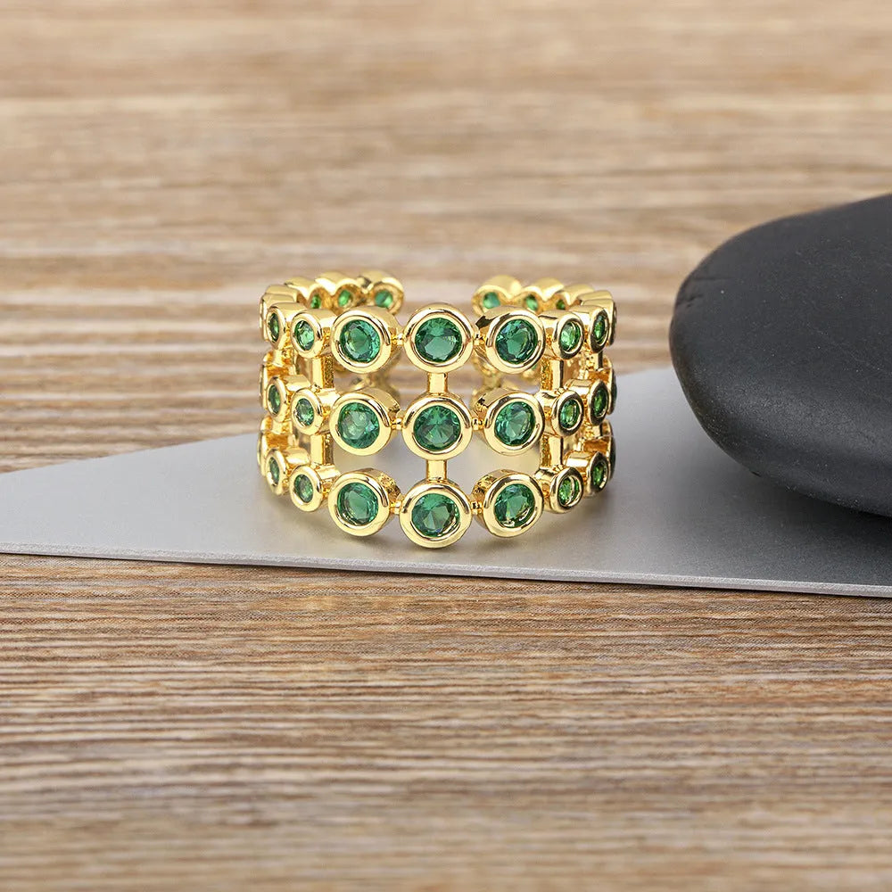 Copper ring with 18K gold plating and green zircon accents in wide band three-layer design