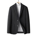 Men's slim fit wool suit jacket in grey shown on a model, suitable for autumn and winter wear.