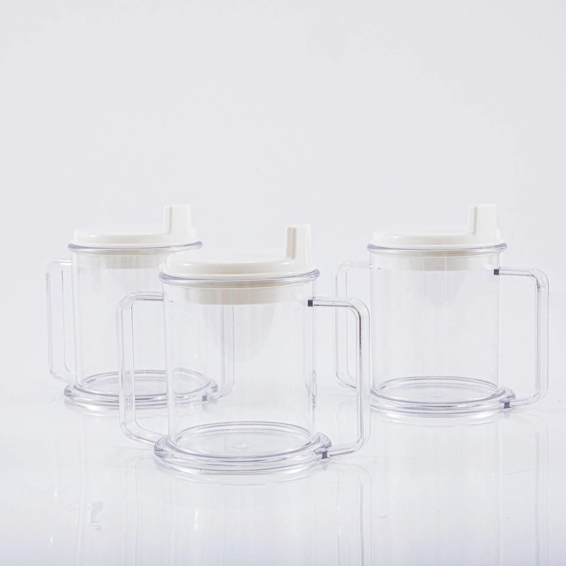 Transparent lightweight plastic drinking cup with spill-proof design on a plain background