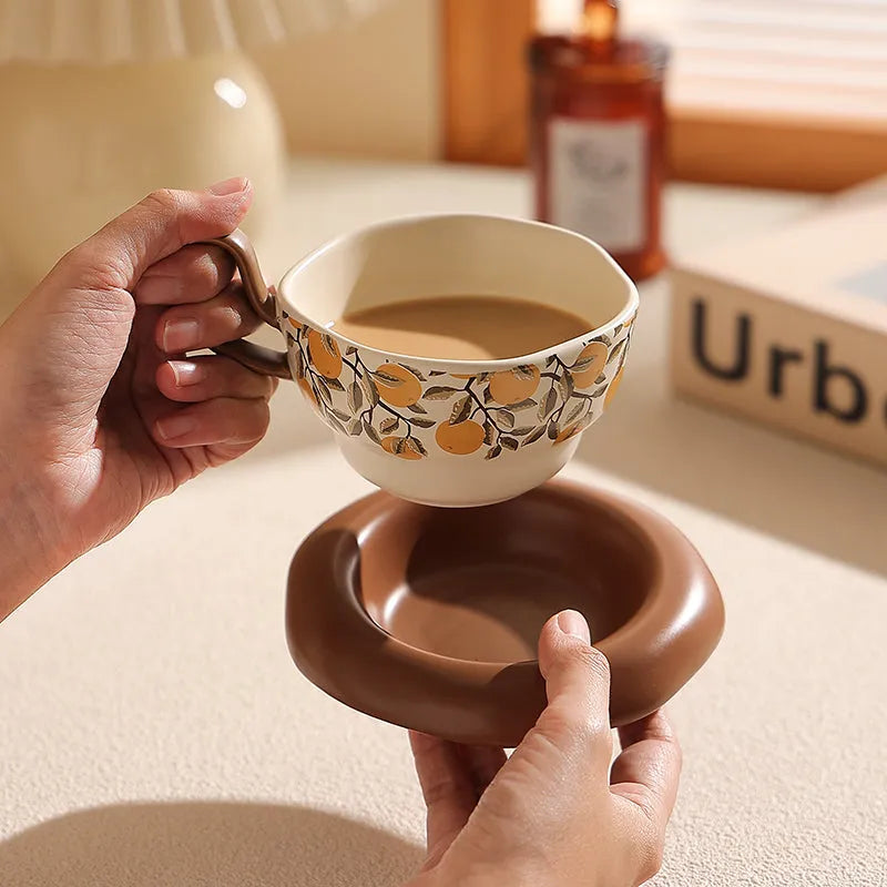 Retro antique style ceramic coffee cup and saucer set in black or orange with 210ml capacity.