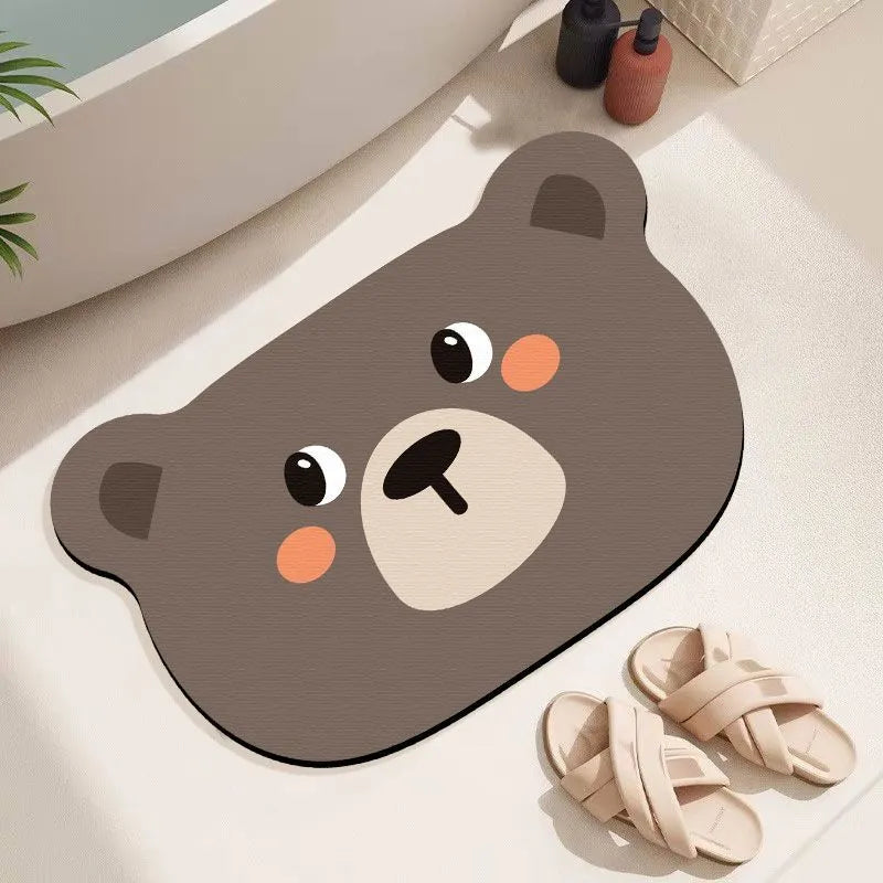 Cartoon animal diatomite bathroom mat in alien shape on tiled floor.