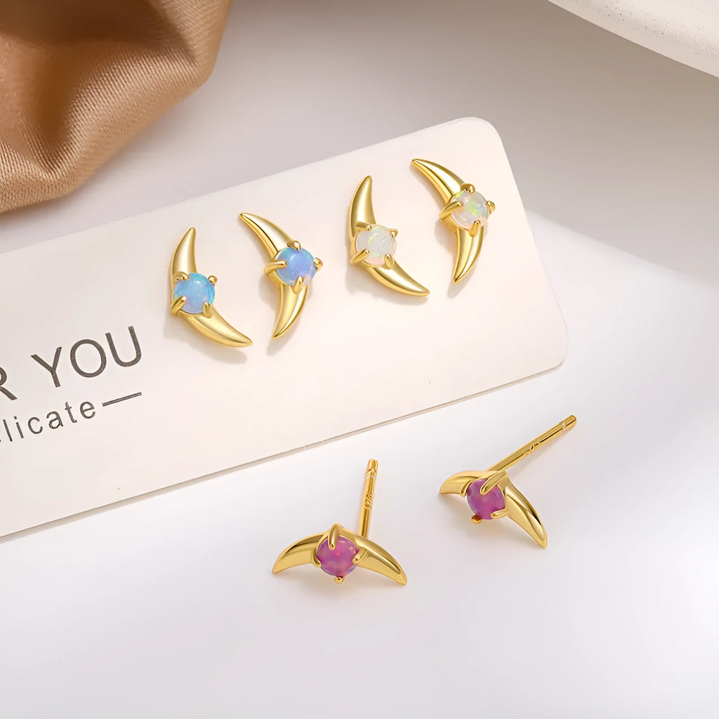 A pair of geometric drop earrings made from 925 silver with a coloured cubic zirconia stone.