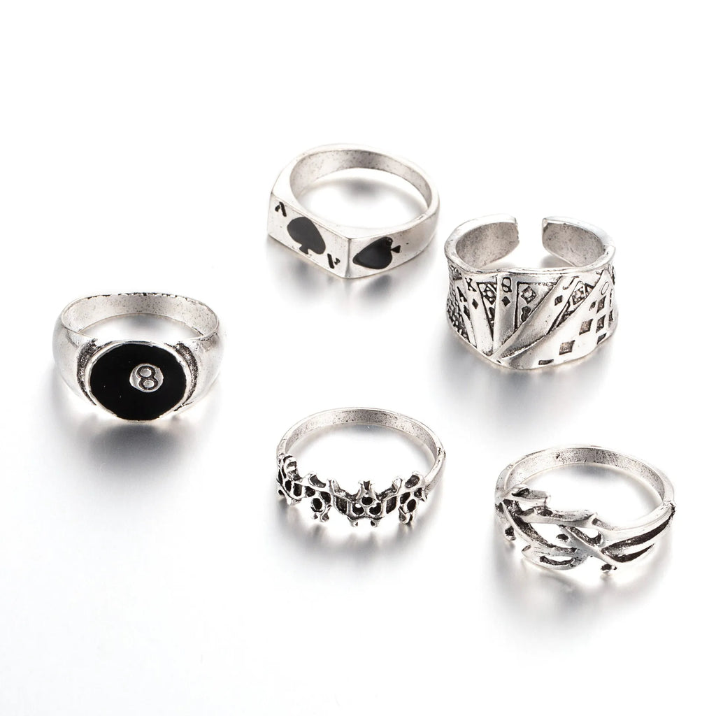 Close-up of a black zinc alloy ring with a detailed retro spade charm on an adjustable band.