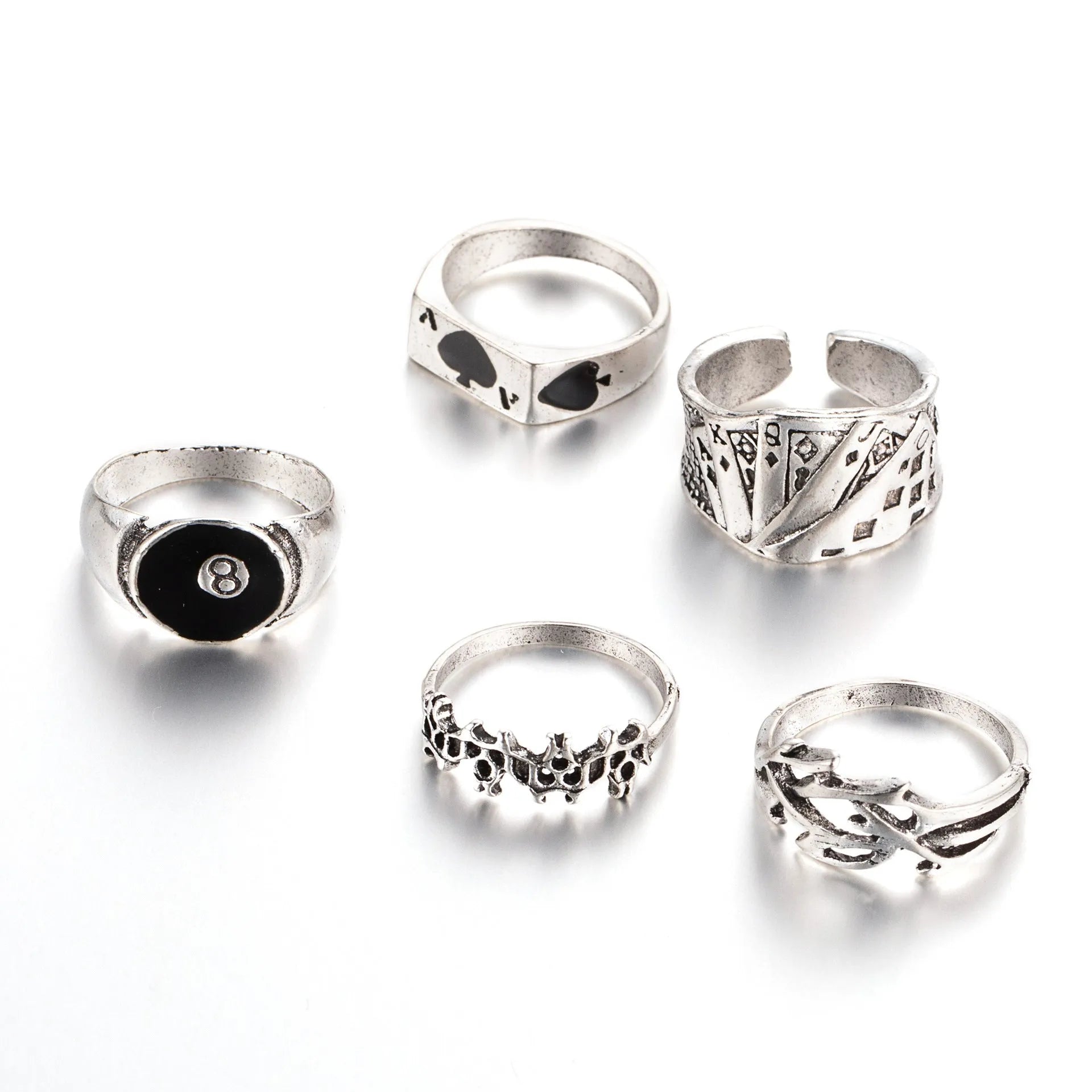 Close-up of a black zinc alloy ring with a detailed retro spade charm on an adjustable band.