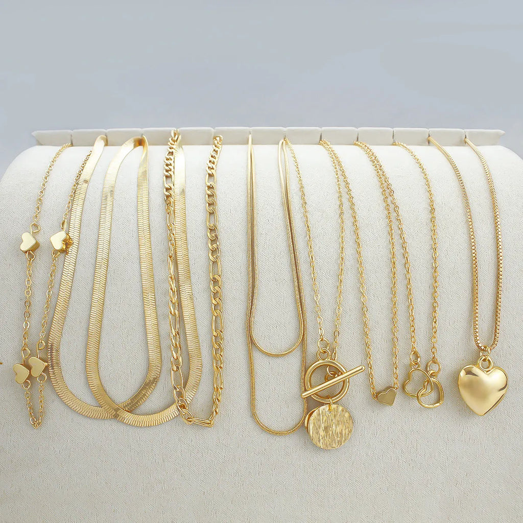Women's gold electroplated necklace set with ten alloy pendants on adjustable snake bones chain