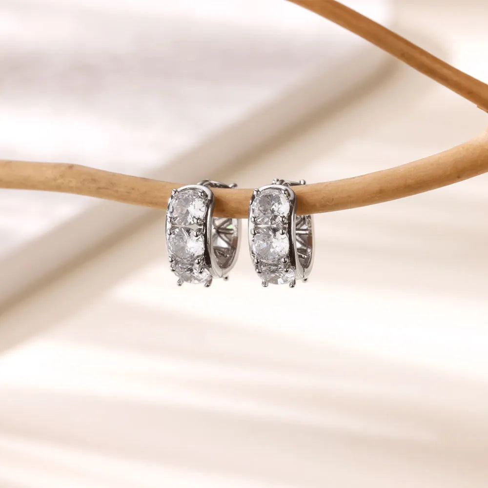 U-shaped stainless steel ear clip earrings for women with inlaid zircon stones in colour E5772P.