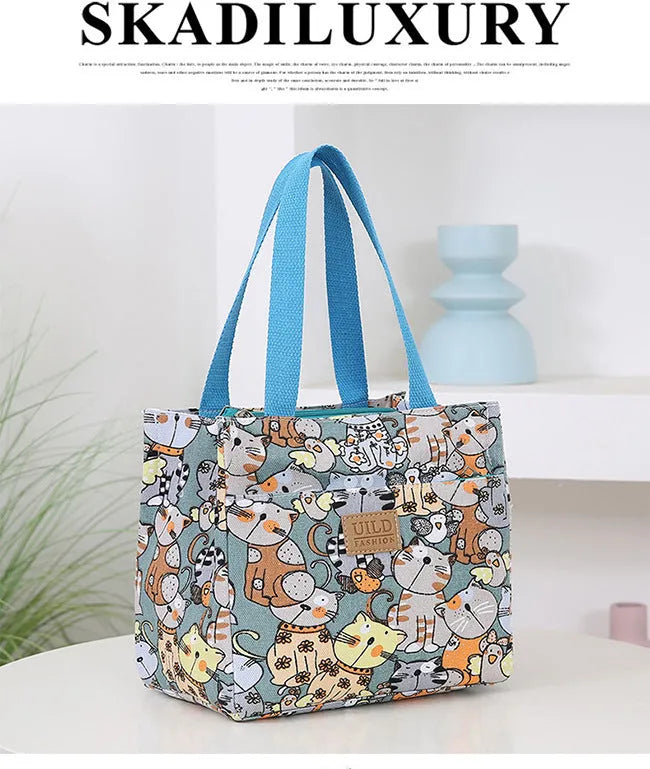 Women's printed canvas bag with aluminium frame showing floral pattern design and horizontal square shape