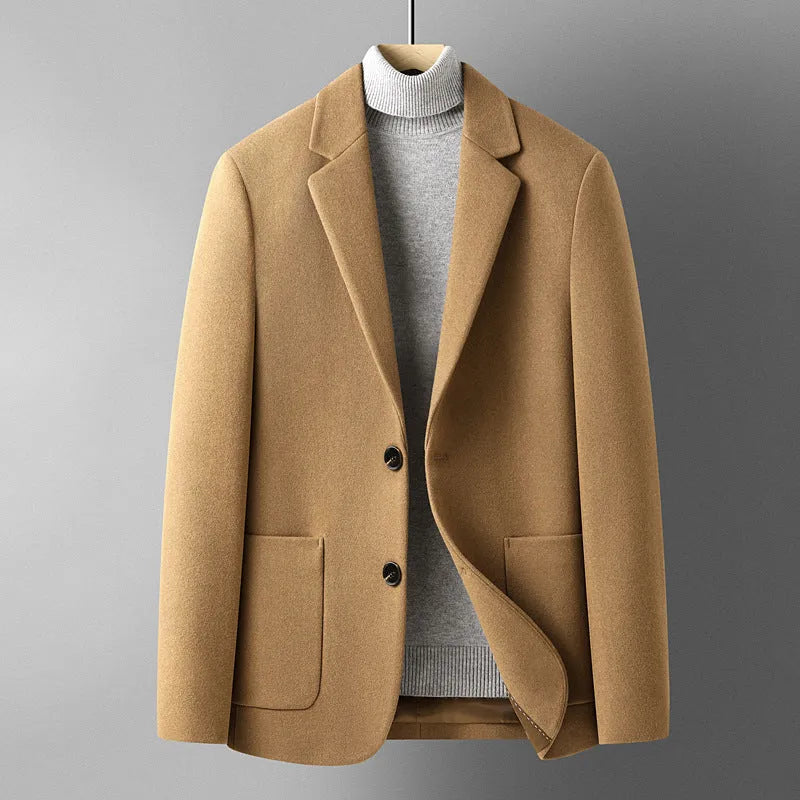 Men's slim fit wool suit jacket in grey shown on a model, suitable for autumn and winter wear.
