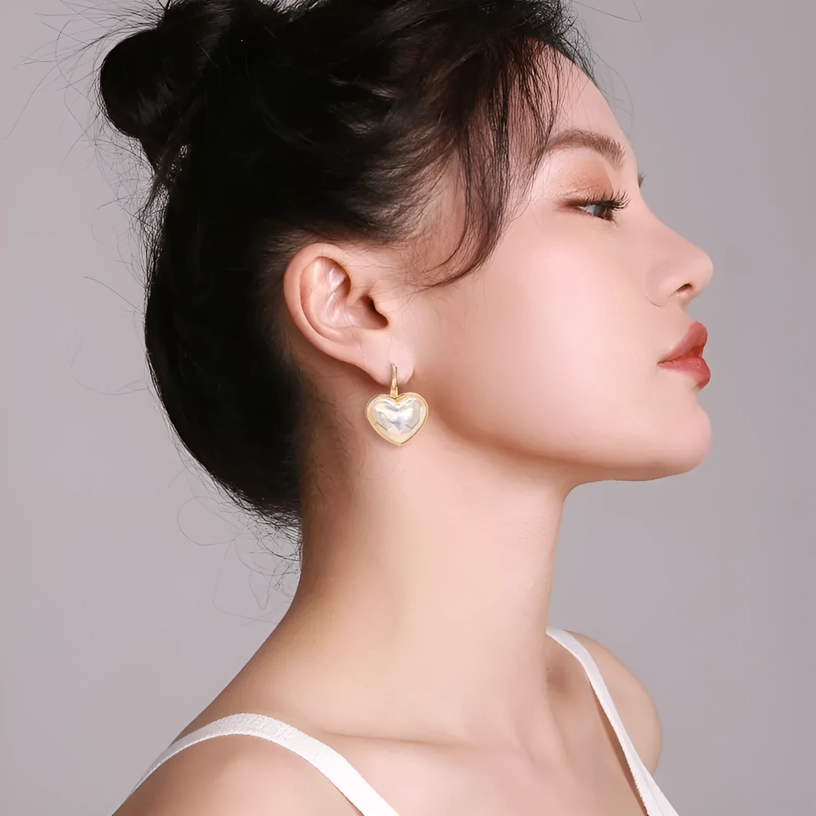 Gold coloured alloy women's ear clip with natural style and metal decorative elements.