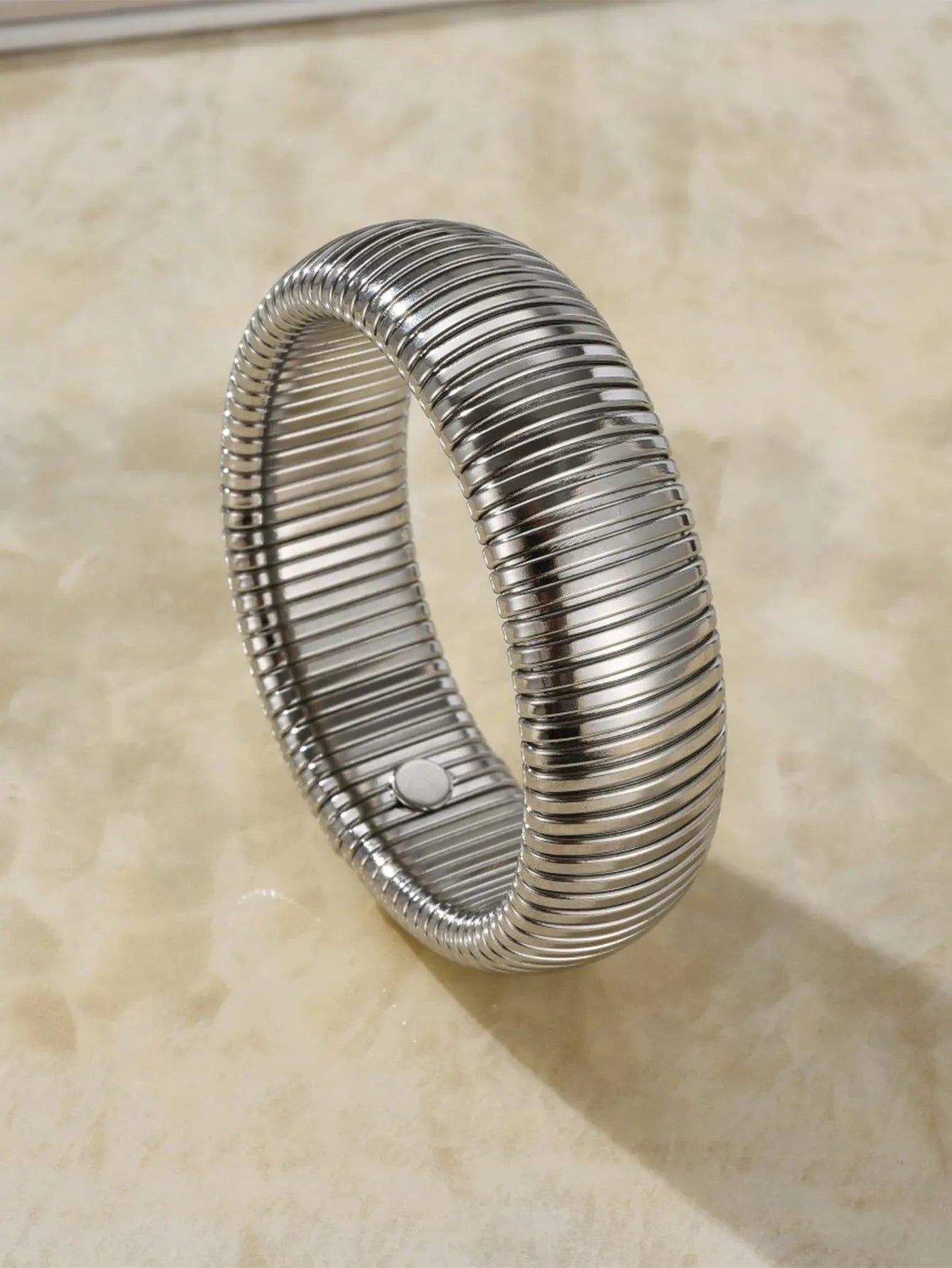 Women's titanium steel bracelet with vertical stripe pattern in gold or silver finish