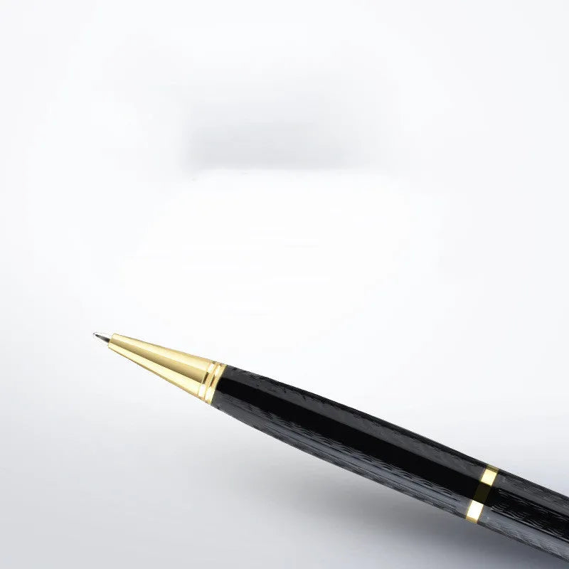 Black pen-shaped digital voice recorder with zinc alloy shell, shown next to included headset and data cable