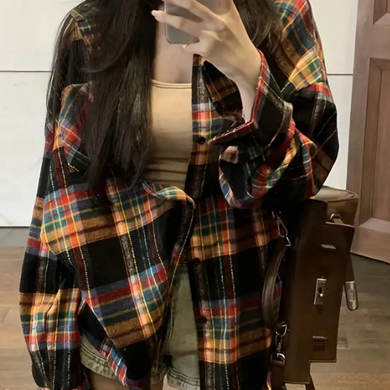 Women's loose-fit retro plaid cotton shirt in black, shown on a hanger