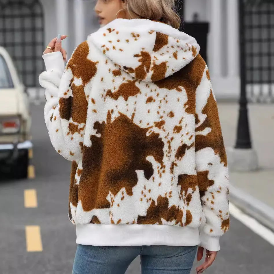 Yellow brown cow print hooded zip cardigan jacket on a hanger