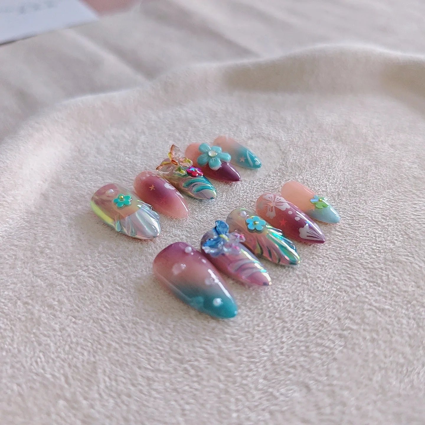 Handmade floral and butterfly nail sculpture charms in four sizes for almond nail art