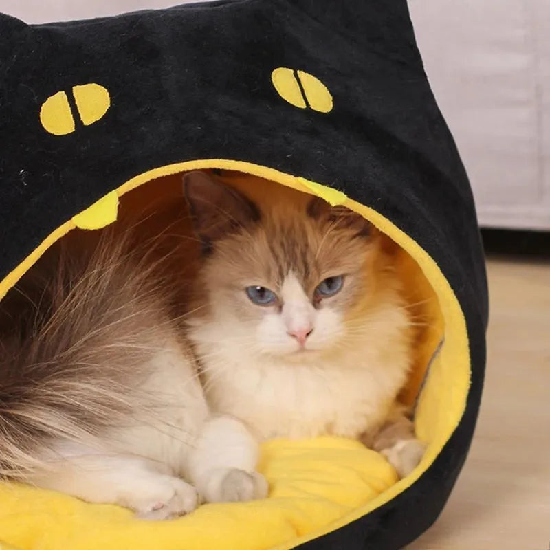 Soft warm cat bed in cat shape design with anti-slip bottom, machine washable, available in S and L sizes.