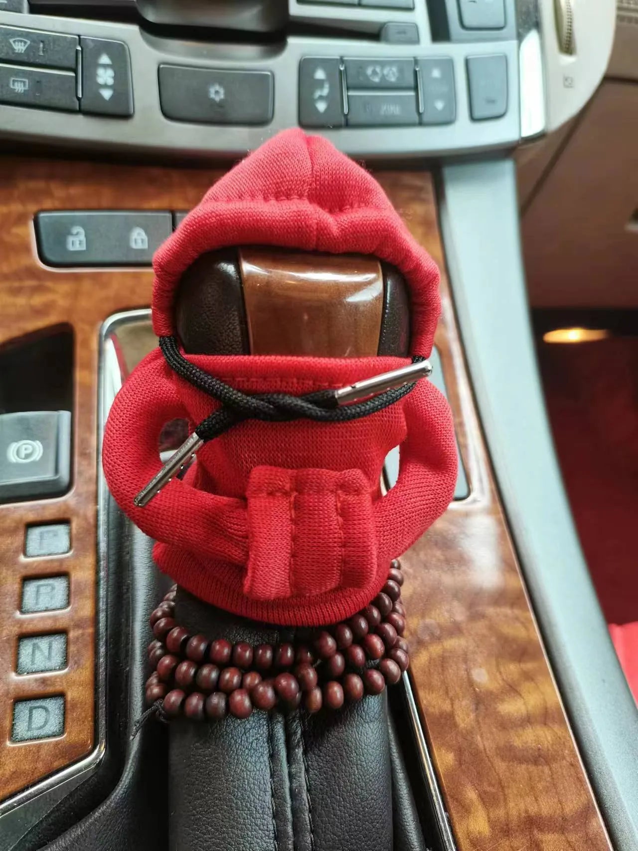 Dutch velvet car gear handle sleeve cover shown in various colours including black, red, blue, and pink.