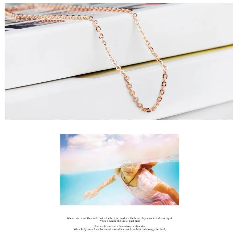 Women's heart-shaped pink crystal pendant with rose gold electroplated finish and matching cross chain