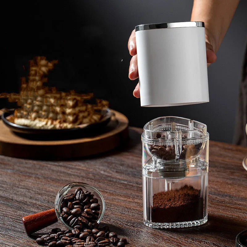 Frosted white electric coffee grinder with ceramic burr, USB-C port, and 25g capacity on a table