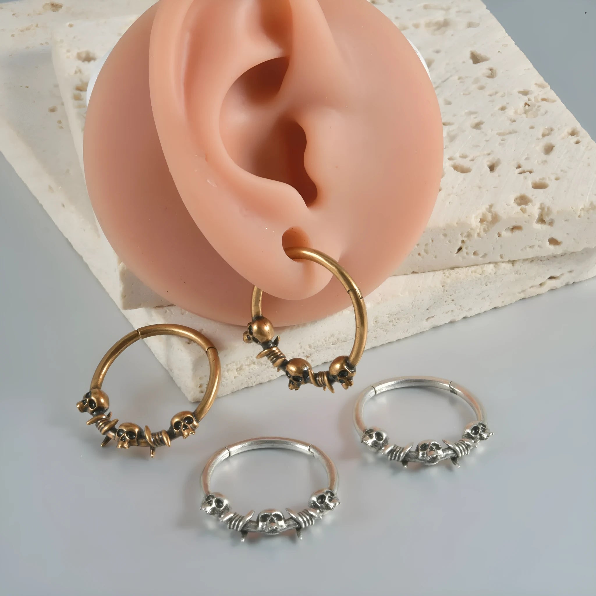Copper punk earrings with vintage ghost head designs in antique gold and silver metallic finishes